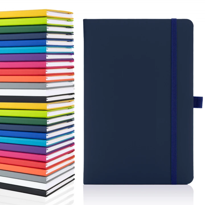 Blanco A5 plain page notebook in navy showing front cover to the right with the thirteen available colours stacked on top of each other to the left
