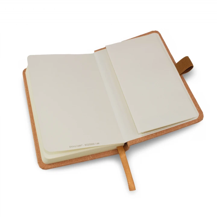 Envirobook A6 natural notebook opened to back page showing the envelope pocket