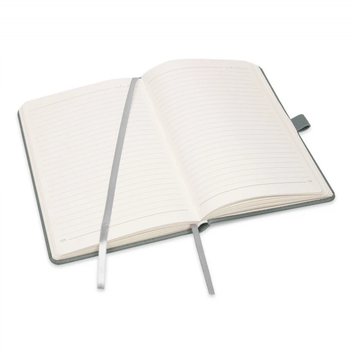 Moretti A5 light grey notebook opened to middle page showing lined pages and ribbon page marker