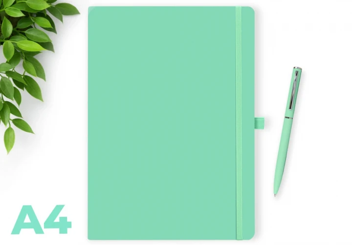 Wilson pastel aqua marine A4 notebook with elastic closure and matching pen on a white background, with green leaves in the corner