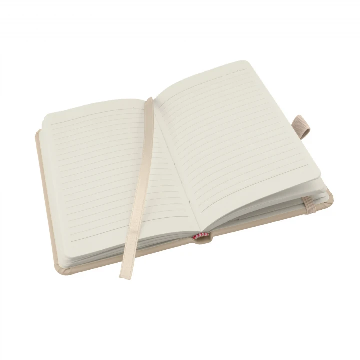 Wilson A6 pastel mushroom notebook opened to middle page showing lined pages, ribbon page marker and pen holder