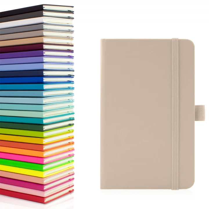 Wilson A6 pocket notebook in pastel mushroom showing front cover to the right with the thirty available colours stacked on top of each other to the left