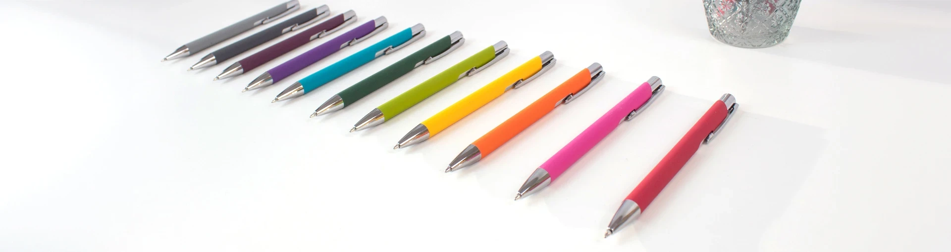 Lago ball pens in a diagonal row on a white background